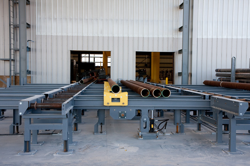 Roller Conveyor with Lift-and-Carry Transfers for Handling Round Steel Tube