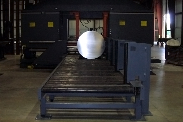 View of a custom Steel Storage Systems' roller conveyor transferring a large diameter billet to saw system.