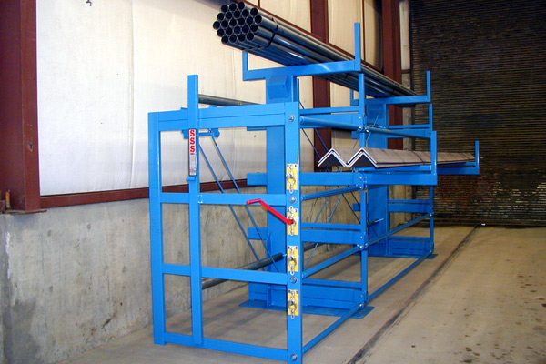 Front side-view of a One-Sided, Right-Hand Cantilever SpaceSaver Rack against a wall. This model has 4 roll-out levels and a fixed top-level