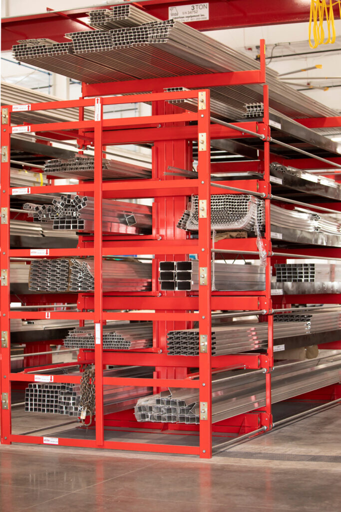 6T SpaceSaver Roll-Out Cantilever Rack storing aluminum tubing and structurals